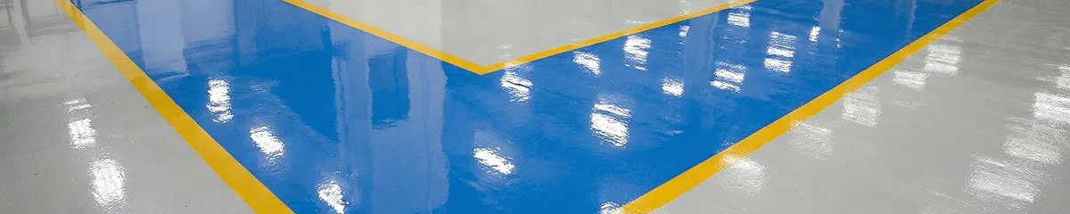 A factory floor professionally covered and marked with epoxy flooring in Irvine, CA