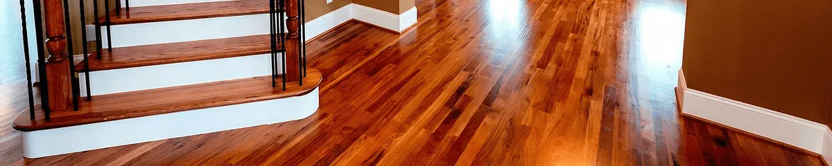 Base floor of a staircase with professionally restored wood flooring in Irvine CA