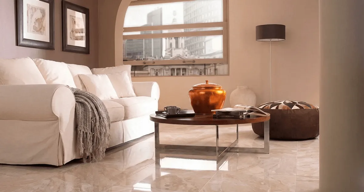Modern living room with professionally installed marble flooring, a beige sofa, coffee table in Irvine, CA