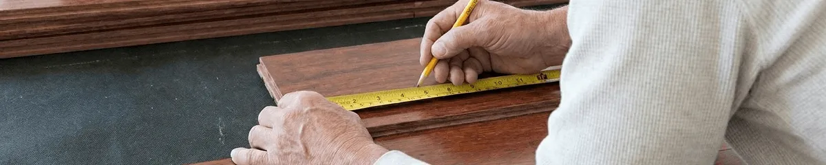 A professional installing wood flooring in Irvine, CA